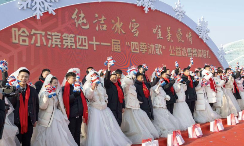 Loving couples take part in a group wedding at the Harbin Ice-Snow World in Harbin, northeast China's Heilongjiang Province, Jan. 6, 2025. A free group wedding which is part of the Harbin International Ice and Snow Festival was held at the Harbin Ice-Snow World on Monday. The winter-themed event was participated by 43 couples from 17 provinces, municipalities or regions in China. (Xinhua/Xie Jianfei)