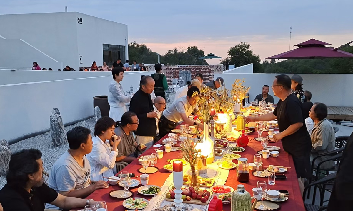 Artists celebrate their 10th anniversary of settling in Caizigou village. Photo: Courtesy of Xiang Jun