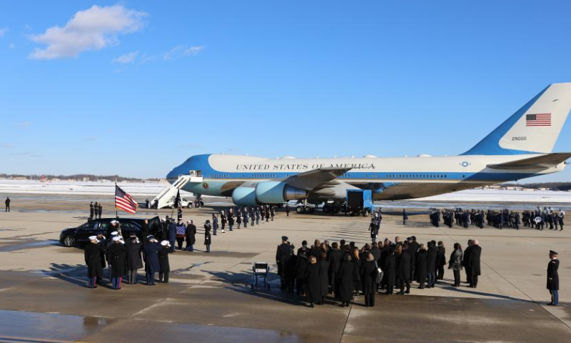 Former U.S. President Jimmy Carter's coffin is placed into a presidential hearse at Joint Base Andrews in Maryland, the United States, on Jan. 7, 2025. The body of former U.S. President Jimmy Carter, who recently passed away at the age of 100, arrived in Washington, D.C. on Tuesday. A presidential jet departed from Atlanta, Georgia, earlier in the day and landed at Joint Base Andrews in Maryland, just outside the capital, Tuesday afternoon. (Xinhua/Hu Yousong)