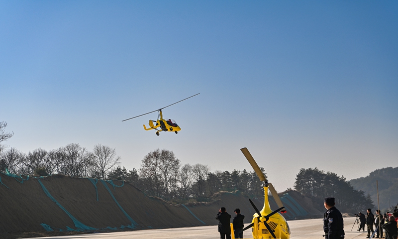 Tourists and local residents in Yuexi county, Anqing in East China's Anhui Province enjoy an experience event for operating low-flying aircrafts on January 1, 2025 to celebrate the New Year. Photo: VCG