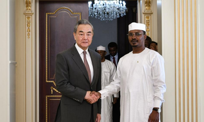 Chadian President Mahamat Idriss Deby Itno (R, Front) shakes hands with Chinese Foreign Minister Wang Yi, also a member of the Political Bureau of the Communist Party of China Central Committee, during their meeting in N'Djamena, Chad, on Jan. 8, 2025. (Xinhua/Han Xu)