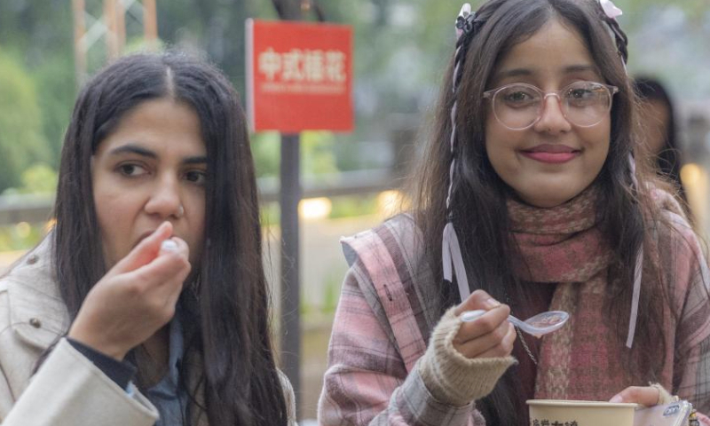 International students taste Laba porridge in Pianyan ancient town, Beibei District, southwest China's Chongqing Municipality, Jan. 7, 2025.

A group of international students attended a cultural event here on Tuesday to experience traditional Chinese culture. (Xinhua/Huang Wei)