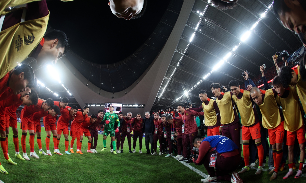 Chinese national football team players gather in a circle to cheer each other on before their World Cup qualifier against Japan on November 19, 2024 in Xiamen, Fujian Province. Photo: VCG