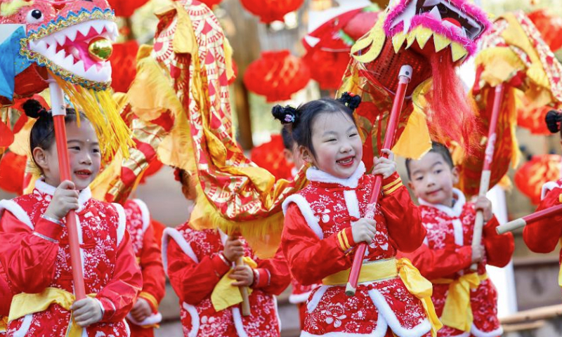 Children try dragon dance at a kindergarten in Huangshan City, east China's Anhui Province, Jan. 17, 2025. Various activities were held across the country to welcome the upcoming Chinese New Year, or Spring Festival, which falls on Jan. 29 this year. (Photo by Shi Yalei/Xinhua)