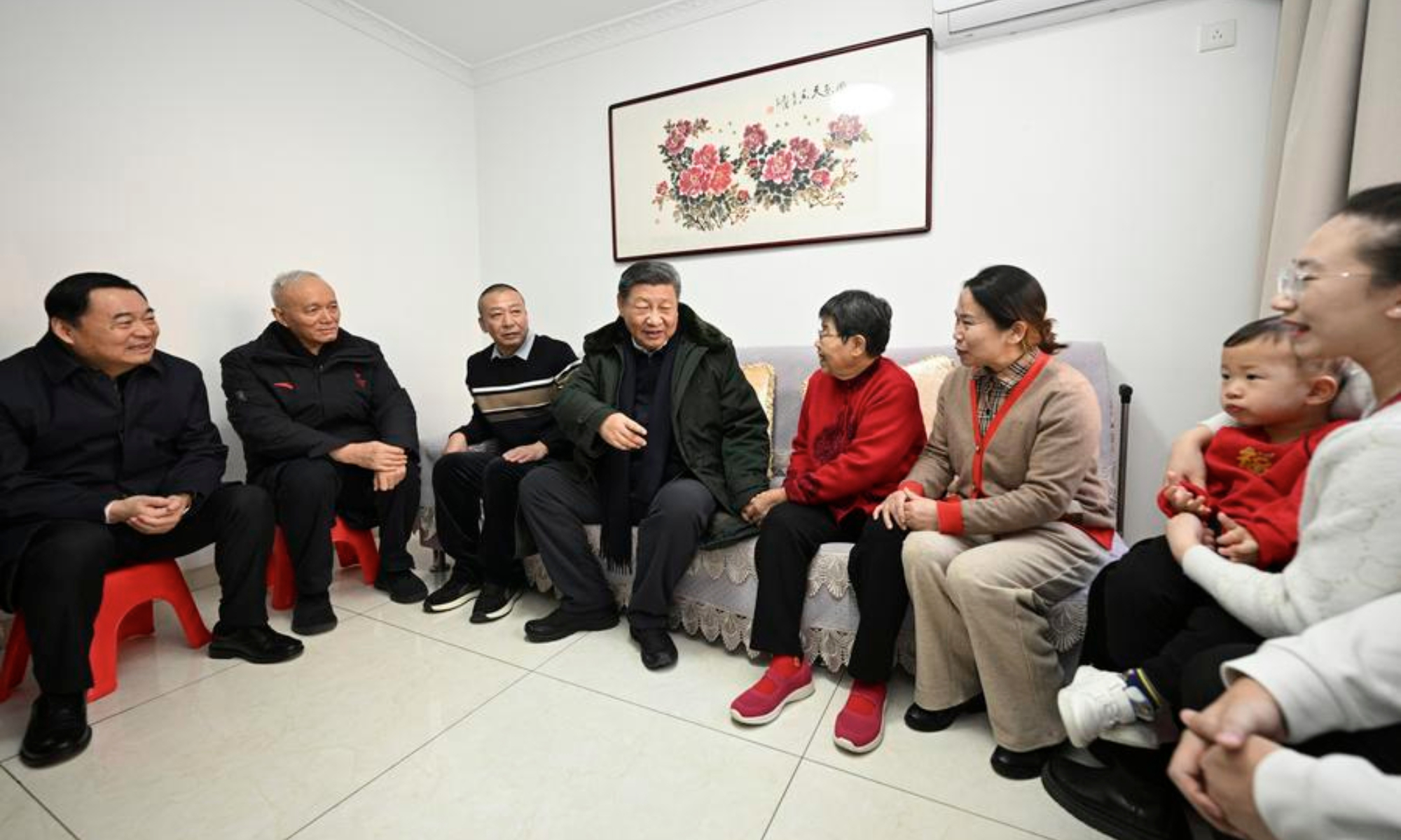 Chinese President Xi Jinping, also general secretary of the Communist Party of China Central Committee and chairman of the Central Military Commission, learns about measures in place to optimize public services as well as details of progress made in improving people's life while visiting a residential community in Shenyang, capital city of northeast China's Liaoning Province, Jan. 23, 2025. (Xinhua/Li Xueren)