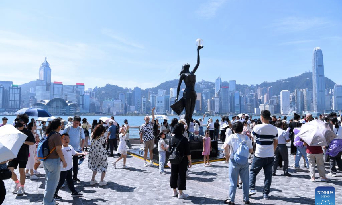 Tourists visit the Avenue of Stars in Hong Kong, south China, Oct. 3, 2024. (Xinhua/Chen Duo)