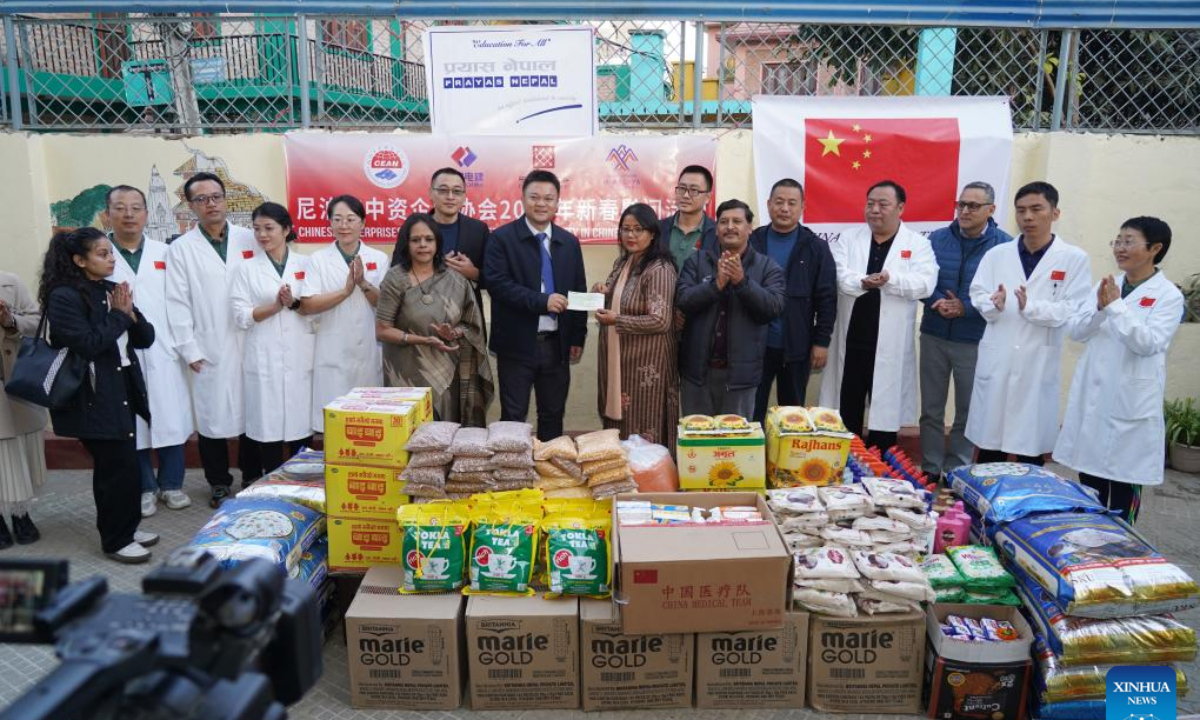 The Chinese Enterprises Association in Nepal makes a donation to Prayas Nepal, a non-profit and non-governmental organization, after a Chinese medical team provided free health check-ups to Nepali orphans in Kathmandu, Nepal, Jan. 22, 2025. Doctors from a Chinese medical team in Nepal provided free health check-ups for some orphans in Kathmandu, the country's capital, on Wednesday. (Photo by Hari Maharjan/Xinhua)