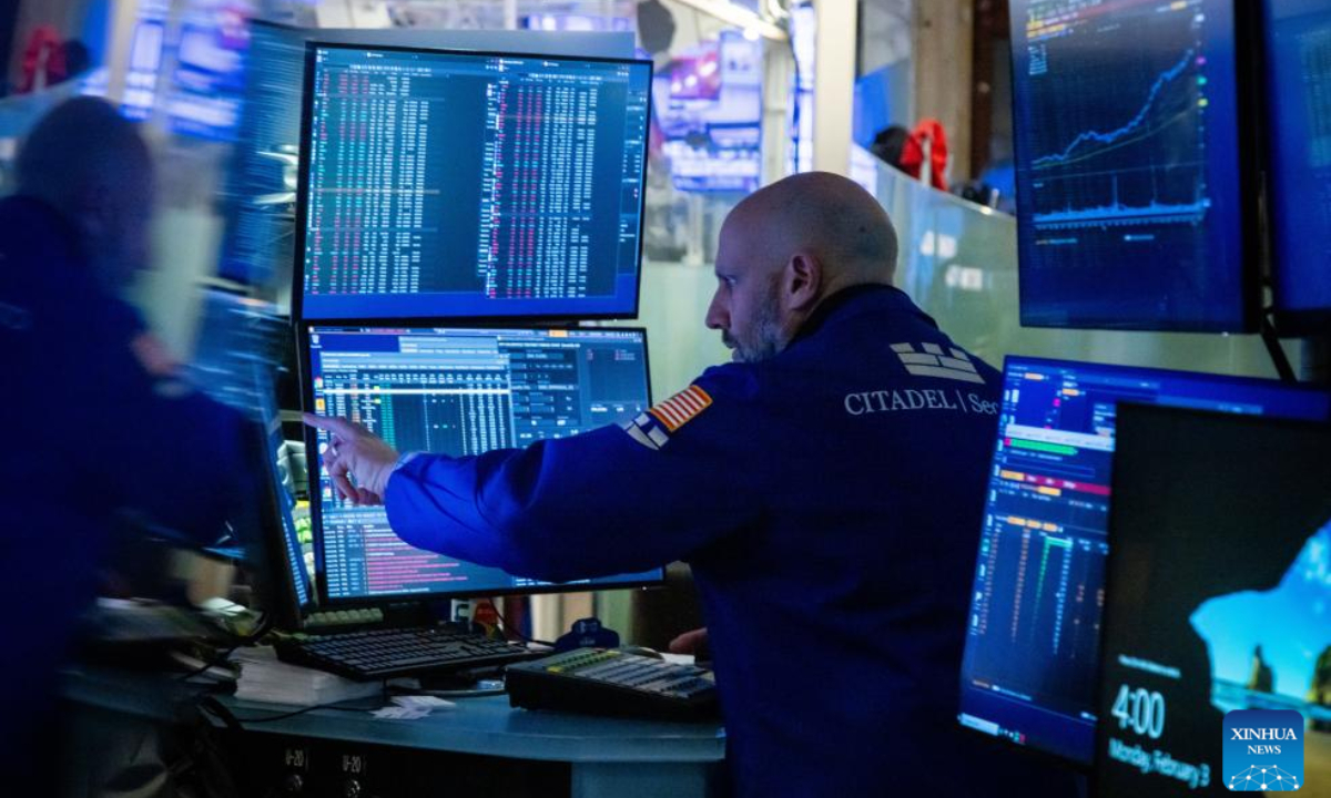 A trader works on the floor of the New York Stock Exchange in New York, the United States, on Feb. 3, 2025. U.S. stocks ended lower on Monday, as investors reacted to the Donald Trump administration's planned tariff rollout. The Dow Jones Industrial Average fell 122.75 points, or 0.28 percent, to 44,421.91. The S&P 500 sank 45.96 points, or 0.76 percent, to 5,994.57. The Nasdaq Composite Index shed 235.49 points, or 1.20 percent, to 19,391.96. (Photo by Michael Nagle/Xinhua)