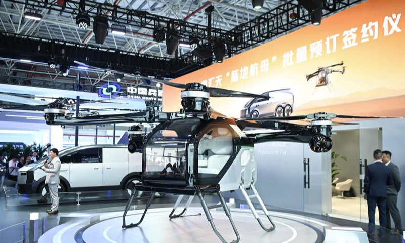 The photo, taken on November 13, 2024, shows a land aircraft, a flying car developed by Chinese electric car maker XPENG. (Xinhua/Deng Hua)