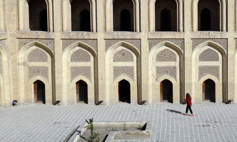 A visitor walks in the courtyard of Mustansiriya Madrasah in Baghdad, Iraq, Jan. 15, 2025. The historical building established in 1227 was once a scholarly complex providing higher education. (Xinhua/Khalil Dawood)