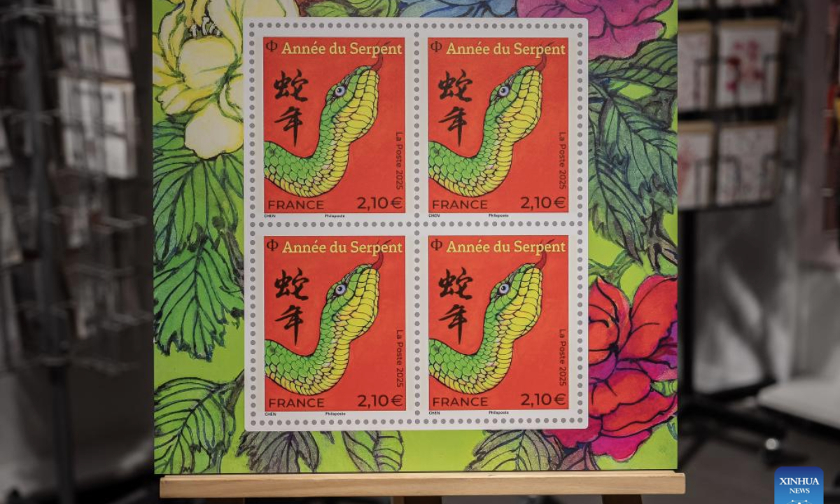 This photo taken on Jan. 18, 2025 shows the Year of the Snake commemorative stamps during a launching ceremony in Paris, France. French post office, La Poste, on Saturday issued two stamps to celebrate the upcoming Chinese New Year, the Year of the Snake, which starts on Jan. 29, 2025. (Photo by Aurelien Morissard/Xinhua)