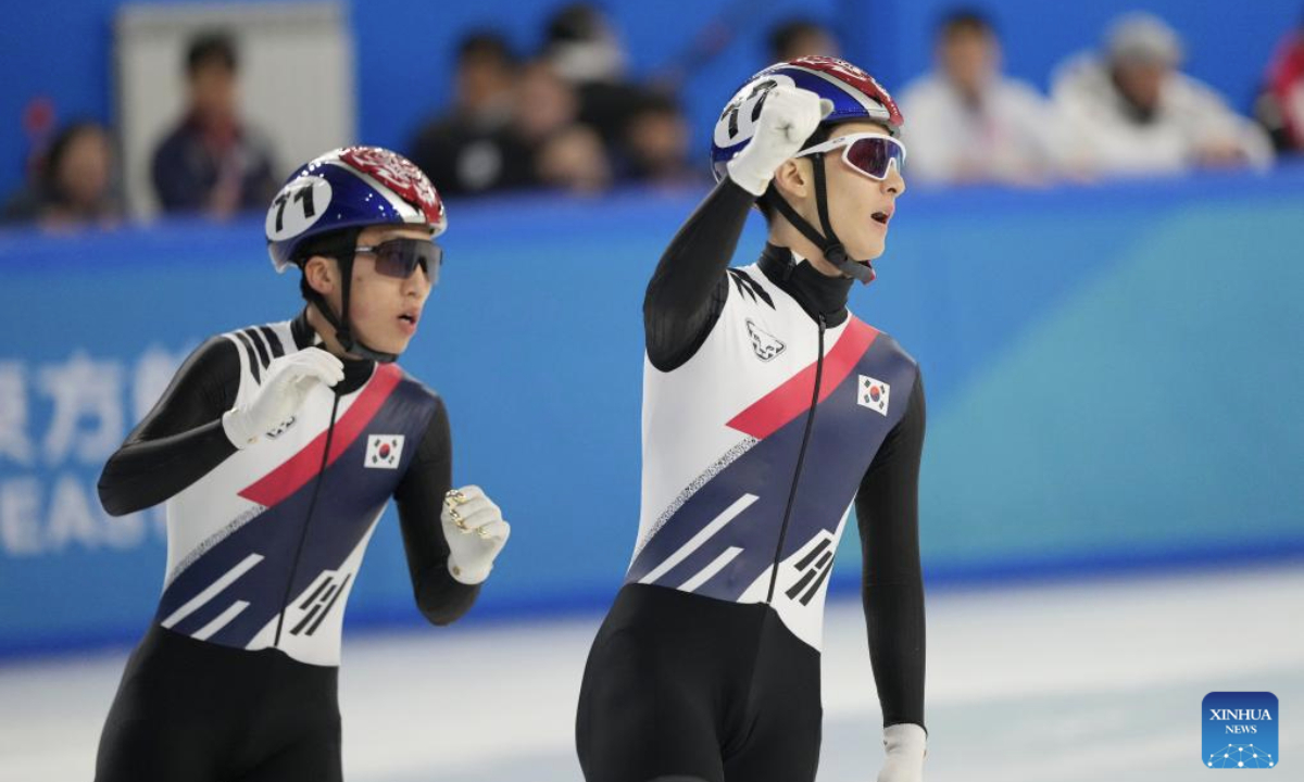 Jang Sungwoo (R) and Park Jiwon of South Korea react after the men's 1000m final match of the short track speed skating event at the 9th Asian Winter Games in Harbin, northeast China's Heilongjiang Province, Feb. 9, 2025. (Xinhua/Yan Linyun)