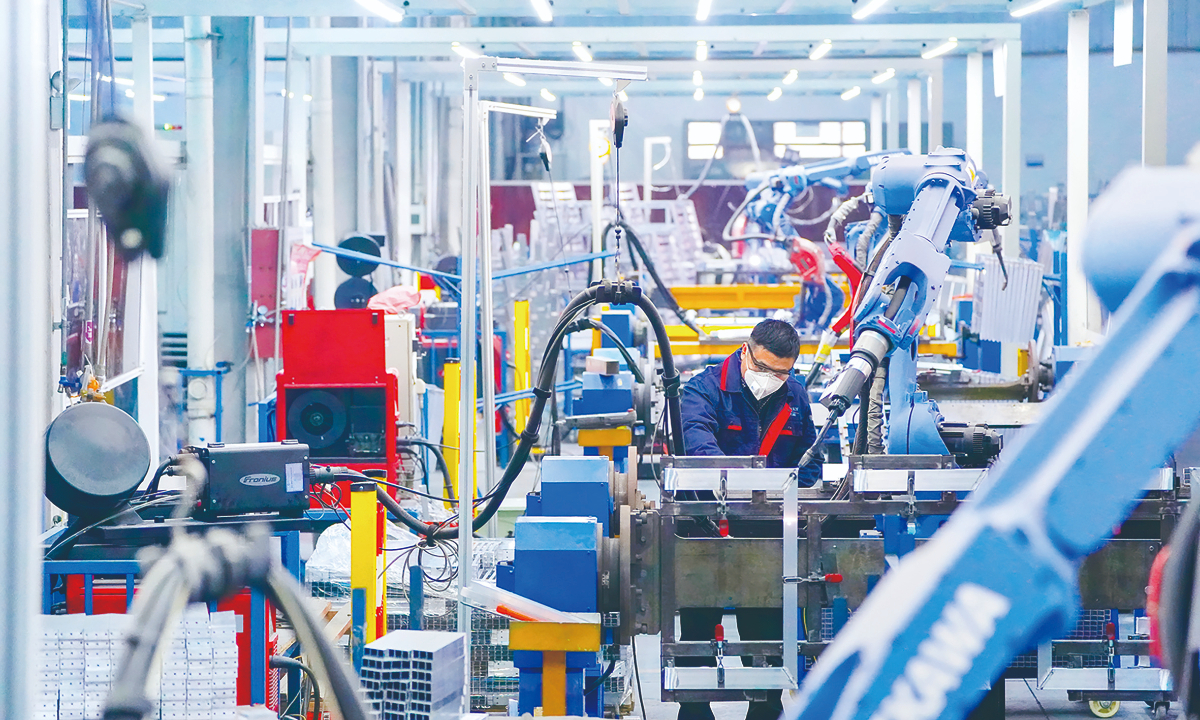 Technicians work on export orders on an intelligent production line in a company in Suqian, East China’s Jiangsu Province. Photo: VCG