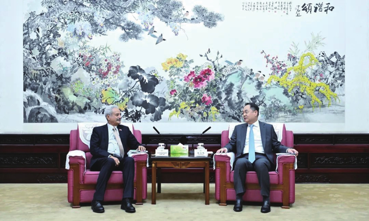 Ambassador of Nepal to China Krishna Prasad Oli (left) meets with Yang Wanming, president of the Chinese People's Association for Friendship with Foreign Countries (CPAFFC) in Beijing, on January 7, 2025. Photo: thepaper.cn