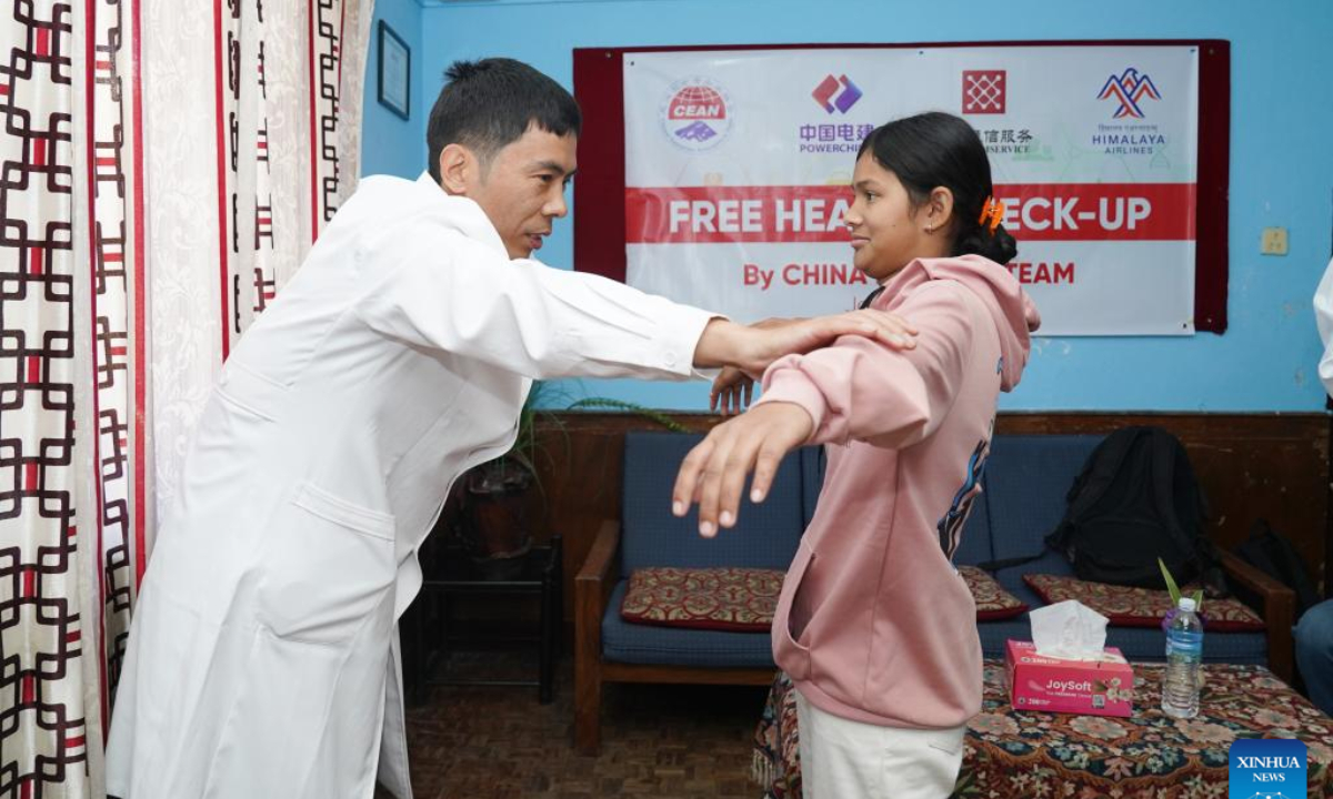 A doctor from a Chinese medical team provides a free health check-up for an orphan at Prayas Nepal, a non-profit and non-governmental organization, in Kathmandu, Nepal, Jan. 22, 2025. Doctors from a Chinese medical team in Nepal provided free health check-ups for some orphans in Kathmandu, the country's capital, on Wednesday. (Photo by Hari Maharjan/Xinhua)