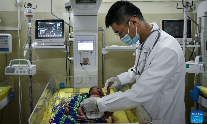 Chinese doctor Xu Kangnan, a member of the 20th Chinese medical team to Chad, examines the condition of a newborn at the China-Chad Friendship Hospital in N'Djamena, Chad, Jan. 9, 2025.