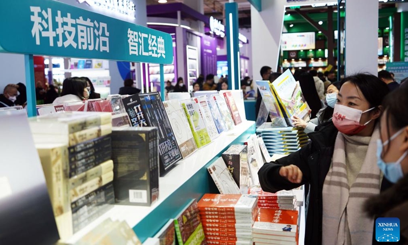 People visit the 2025 Beijing Book Fair in Beijing, capital of China, Jan. 9, 2025. The 2025 Beijing Book Fair opened on Thursday at the China International Exhibition Center, with over 400,000 titles on display, according to the organizers. (Xinhua/Pan Xu)