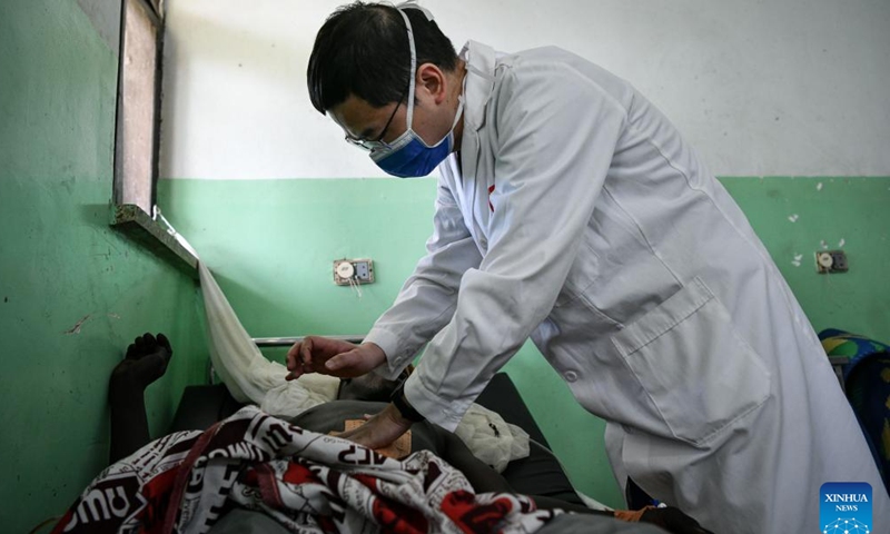 Chinese doctor Wan Zhen, a member of the 20th Chinese medical team to Chad, examines a patient at the China-Chad Friendship Hospital in N'Djamena, Chad, Jan. 9, 2025.