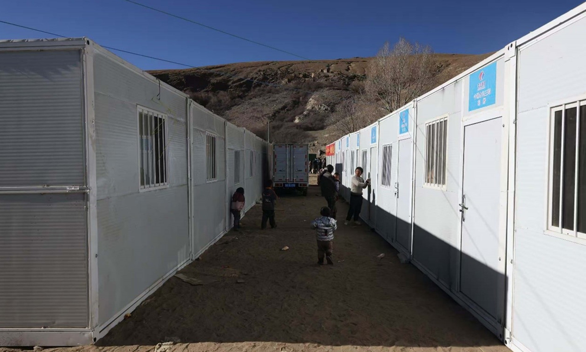 Children play around the prefabricated houses in Gurong village of Changsuo township in Xigaze, Southwest China's Xizang Autonomous Region on January 10, 2025. A 6.8-magnitude earthquake jolted Xigaze on Tuesday. Photo: Fan Wei/GT