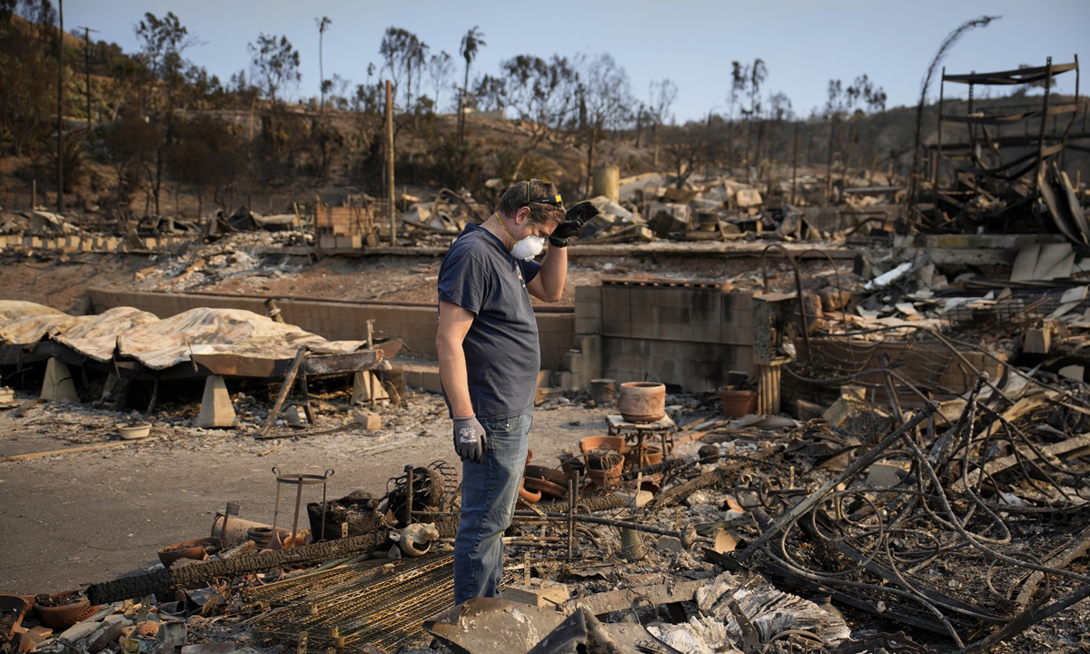 Blazes devour California, but more wind is on the way