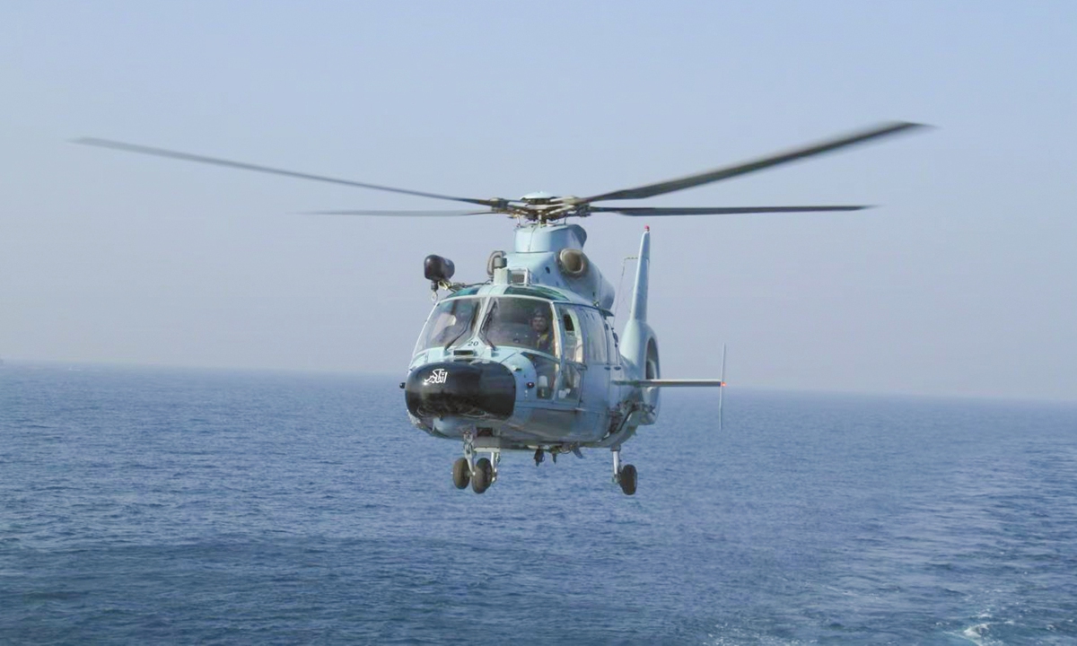 A China-built Z-9 shipborne helicopter of the Pakistan Navy flies over the sea. Photo: Courtesy of the Pakistan Navy