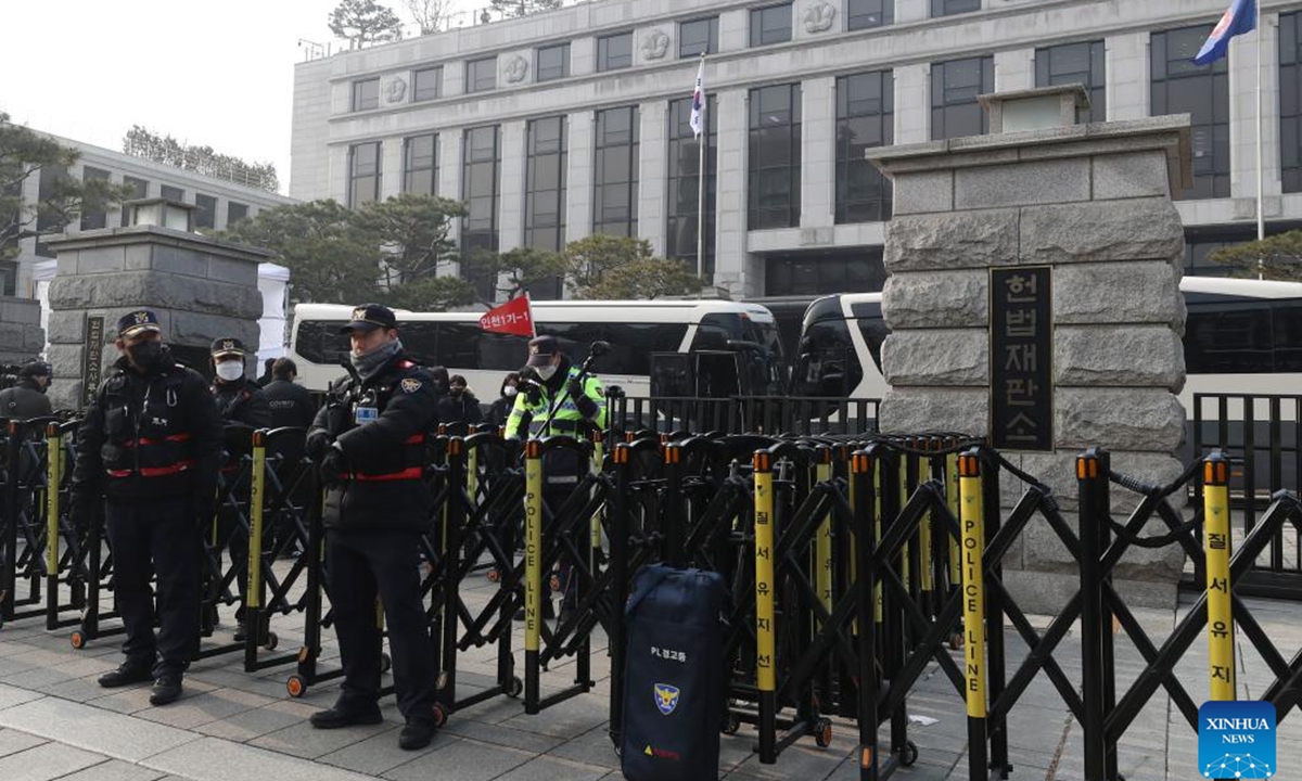 Police are seen on duty in front of constitutional court in Seoul, South Korea, Jan. 21, 2025.

Vehicles carrying arrested President Yoon Suk-yeol arrived at the constitutional court in Seoul for the hearing of his impeachment trial, TV footage showed Tuesday.

The convoy, escorted by police and presidential security service, filed into the court after leaving the Seoul Detention Center in Uiwang, around 30 km south of the court, about 20 minutes earlier. (Xinhua/Yao Qilin)