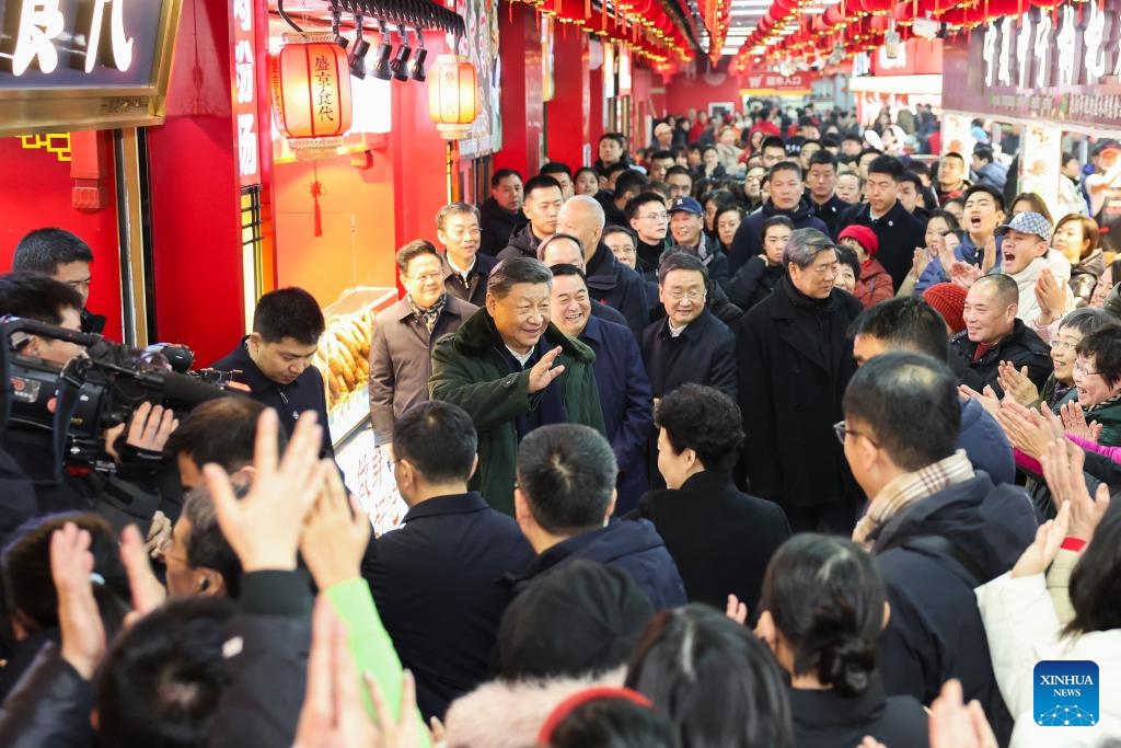 Chinese President Xi Jinping, also general secretary of the Communist Party of China Central Committee and chairman of the Central Military Commission, talks with local people while visiting a food market in Shenyang, capital city of northeast China's Liaoning Province, Jan. 23, 2025. Xi on Thursday inspected Shenyang. (Xinhua/Ding Haitao)