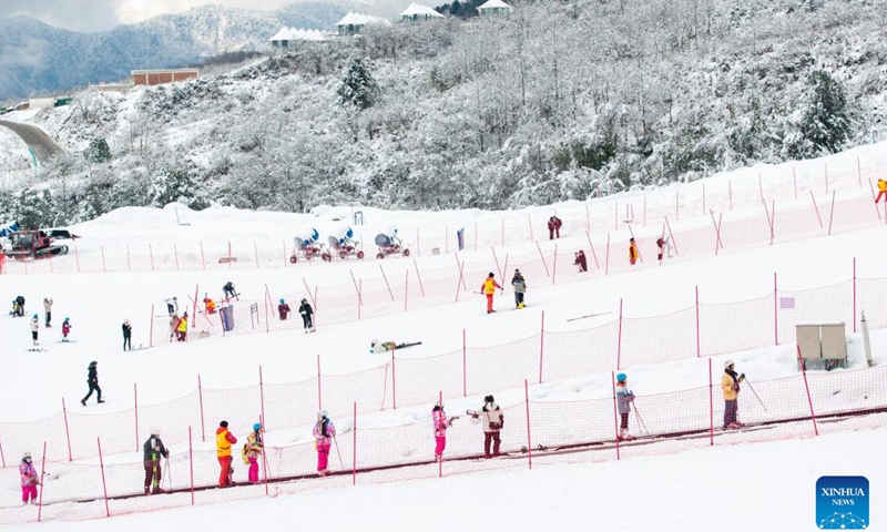 An aerial drone photo taken on Jan. 11, 2025 shows tourists skiing at Wanggangping scenic spot in Shimian County, southwest China's Sichuan Province.