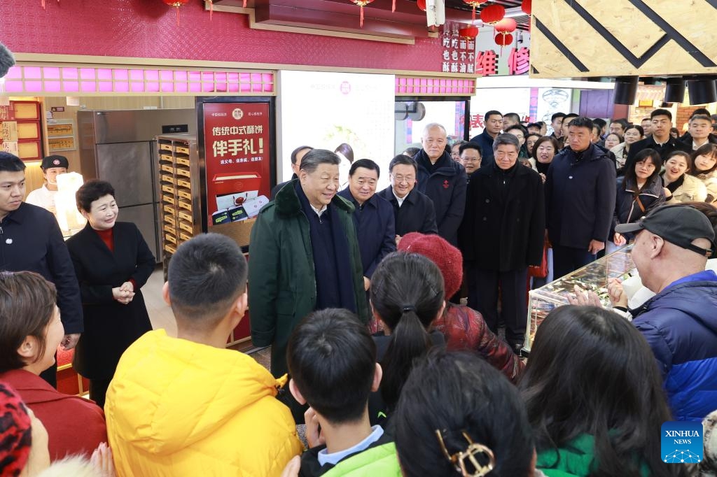 Chinese President Xi Jinping, also general secretary of the Communist Party of China Central Committee and chairman of the Central Military Commission, learns about the supply of goods during the holiday season and measures in place to meet residents' daily needs while visiting a food market in Shenyang, capital city of northeast China's Liaoning Province, Jan. 23, 2025. Xi on Thursday inspected Shenyang. (Xinhua/Wang Ye)