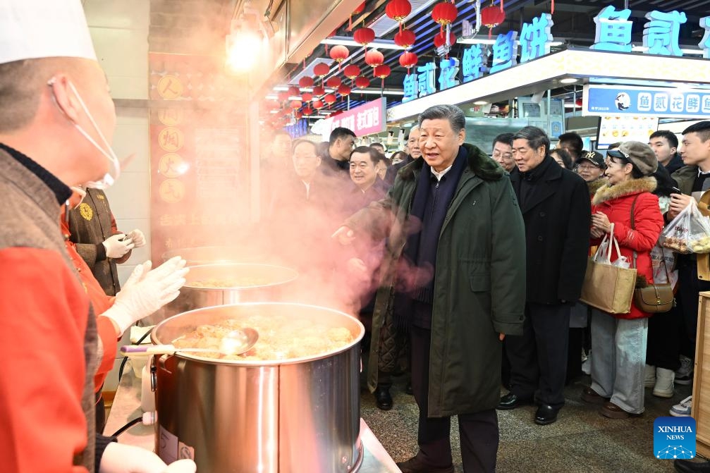 Chinese President Xi Jinping, also general secretary of the Communist Party of China Central Committee and chairman of the Central Military Commission, learns about the supply of goods during the holiday season and measures in place to meet residents' daily needs while visiting a food market in Shenyang, capital city of northeast China's Liaoning Province, Jan. 23, 2025. Xi on Thursday inspected Shenyang. (Xinhua/Xie Huanchi)