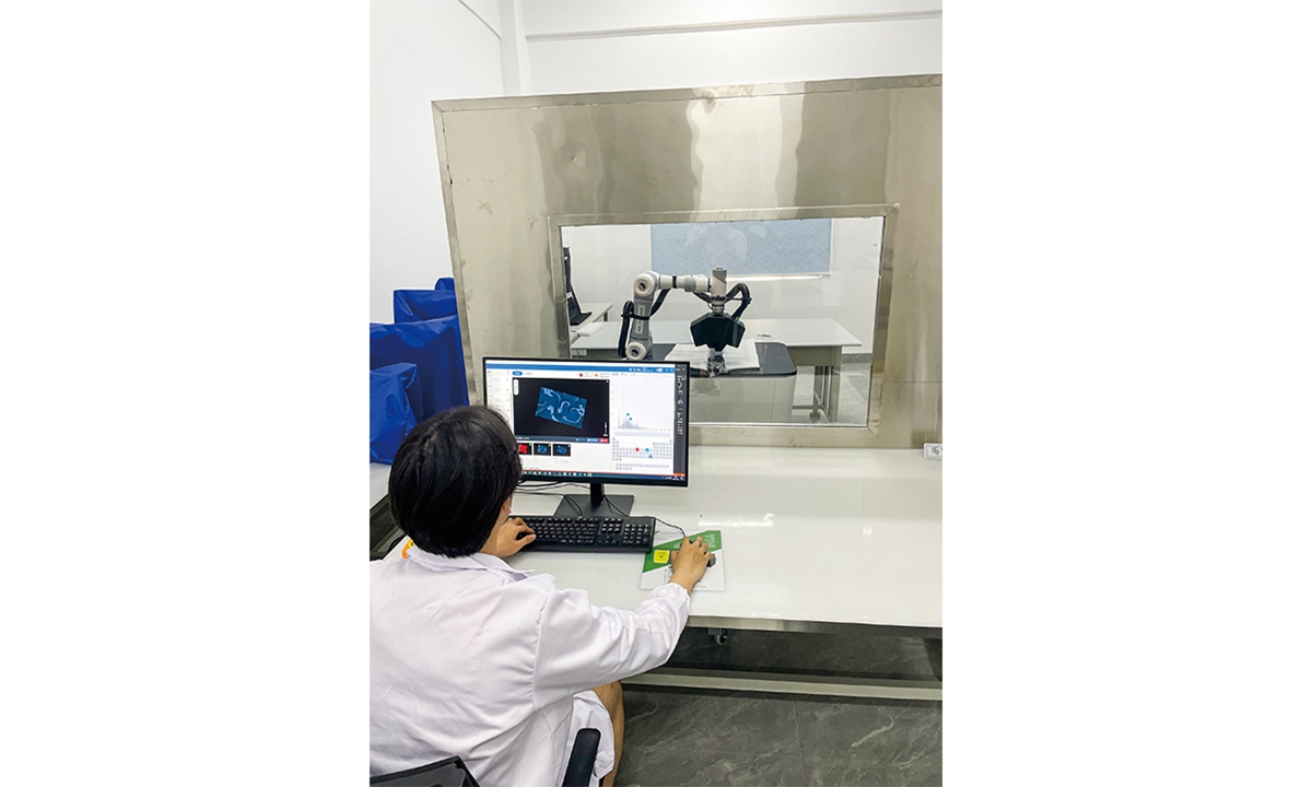 A research staff memeber works on a scan process of the chime stand at the archaeological site of Wuwangdun tomb in April 2024, in East China's Anhui Province. Photo: Jinan Laboratory of Applied Nuclear Science 