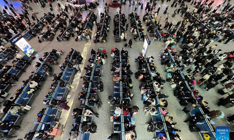 Passengers wait for their trains at the Ningbo Railway Station in Ningbo, east China's Zhejiang Province, Jan. 25, 2025.