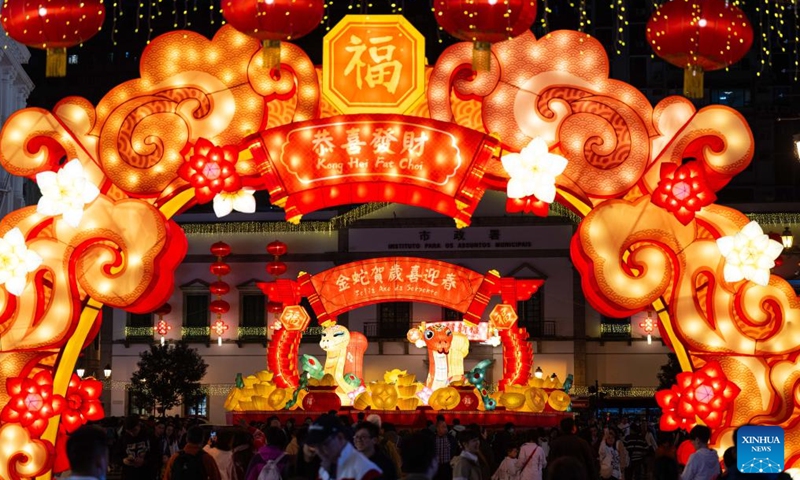 People enjoy the light installations in celebration of the upcoming Spring Festival, or the Chinese Lunar New Year, at the Senado Square in south China's Macao on Jan. 25, 2025. (Xinhua/Cheong Kam Ka)