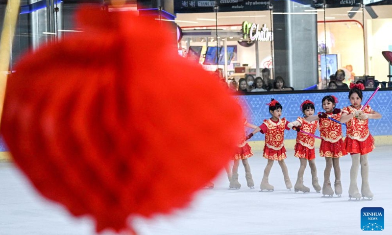 Dancers perform on ice to celebrate upcoming Spring Festival in Indonesia