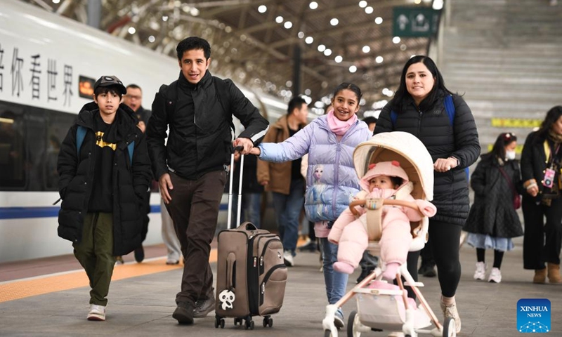 Departing passengers are pictured at a platform of Nanjing Railway Station in Nanjing, east China's Jiangsu Province, Jan. 25, 2025.
