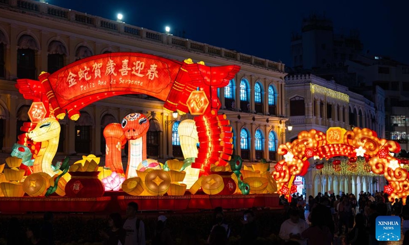 People enjoy the light installations in celebration of the upcoming Spring Festival, or the Chinese Lunar New Year, at the Senado Square in south China's Macao on Jan. 25, 2025. (Xinhua/Cheong Kam Ka)