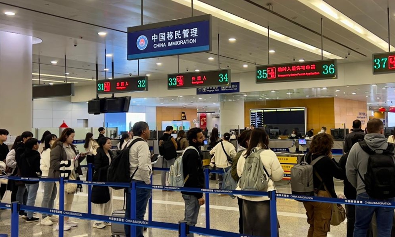 Foreign tourists wait for entry inspection at the Shanghai Pudong International Airport in Shanghai, east China, Jan. 15, 2025. (Photo by Huang Bo/Xinhua)