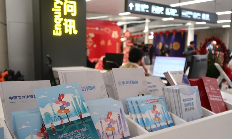 Multi-language versions of service guide booklets are pictured at the Shanghai Hongqiao International Airport in Shanghai, east China, Jan. 26, 2025. (Xinhua/Tang Siqi)