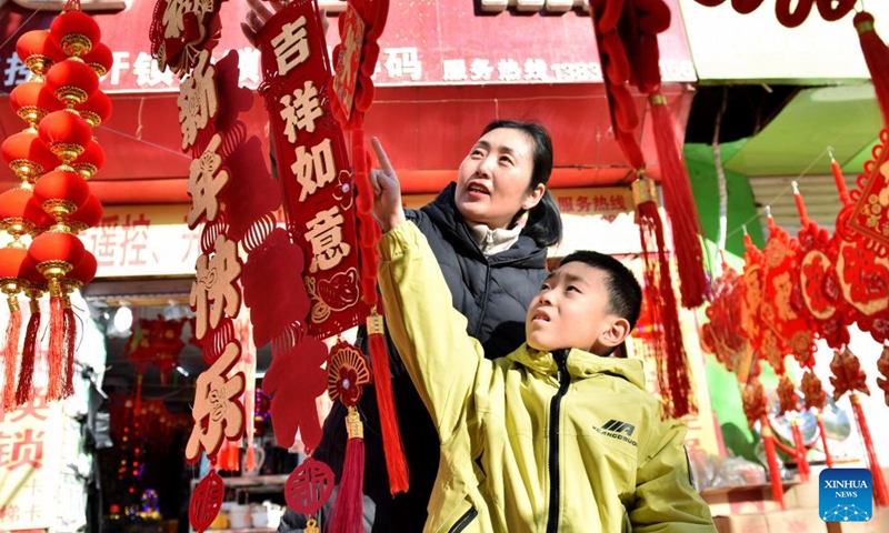 Residents buy Spring Festival decorations at a fair in Xingtai, north China's Hebei Province, Jan. 27, 2025. China is alive with vibrant celebrations with the Spring Festival just around the corner. (Xinhua/Wang Xiao)