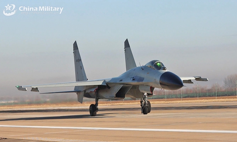 A J-11BS fighter jet attached to the Chinese PLA Naval Aviation University taxies on the runway during a force-on-force flight training exercise on January 4, 2025. (eng.chinamil.com.cn/Photo by Zhang Zhiguang)