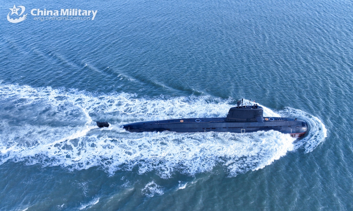 A submarine attached to a naval submarine flotilla under the Chinese PLA Northern Theater Command sails in a surface position during a combat training exercise on January 6, 2025. (eng.chinamil.com.cn/Photo by Zhang Nan)