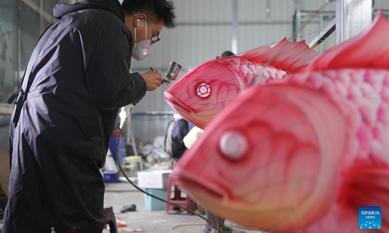 A worker colors a lantern at a workshop in Zigong, southwest China's Sichuan Province, Jan. 14, 2025. The national-level intangible cultural heritage project Zigong lantern show boasts a long history, as it can be traced back to the Tang (618-907) and Song (960-1279) dynasties. In 1964, Zigong held the first lantern show celebrating the Spring Festival. So far, making colorful lanterns has become a popular industry here, with Zigong lanterns having been displayed in more than 80 countries and regions. Making a Zigong lantern involves many craftsmen, including art designers, bench workers, mechanics, electricians and paperhanging workers. The complete process can hardly be found in other places in China. Photo: Xinhua