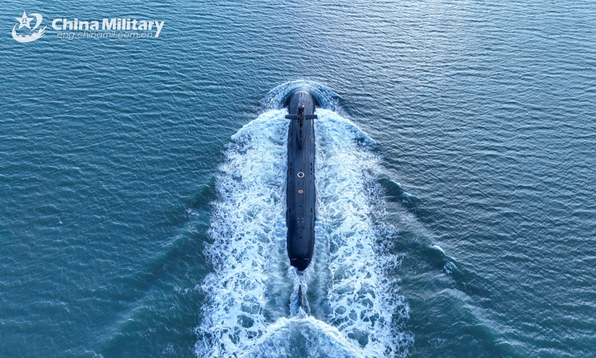 A submarine attached to a naval submarine flotilla under the Chinese PLA Northern Theater Command sails in a surface position during a combat training exercise on January 6, 2025. (eng.chinamil.com.cn/Photo by Zhang Nan)