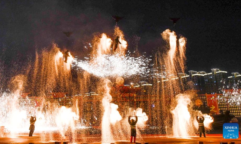 Folk artists stage a molten iron fireworks show at a cultural tourism area in Fengnan District of Tangshan City, north China's Hebei Province, Jan. 29, 2025. Various events were held across China on Wednesday to celebrate the Spring Festival. Photo: Xinhua