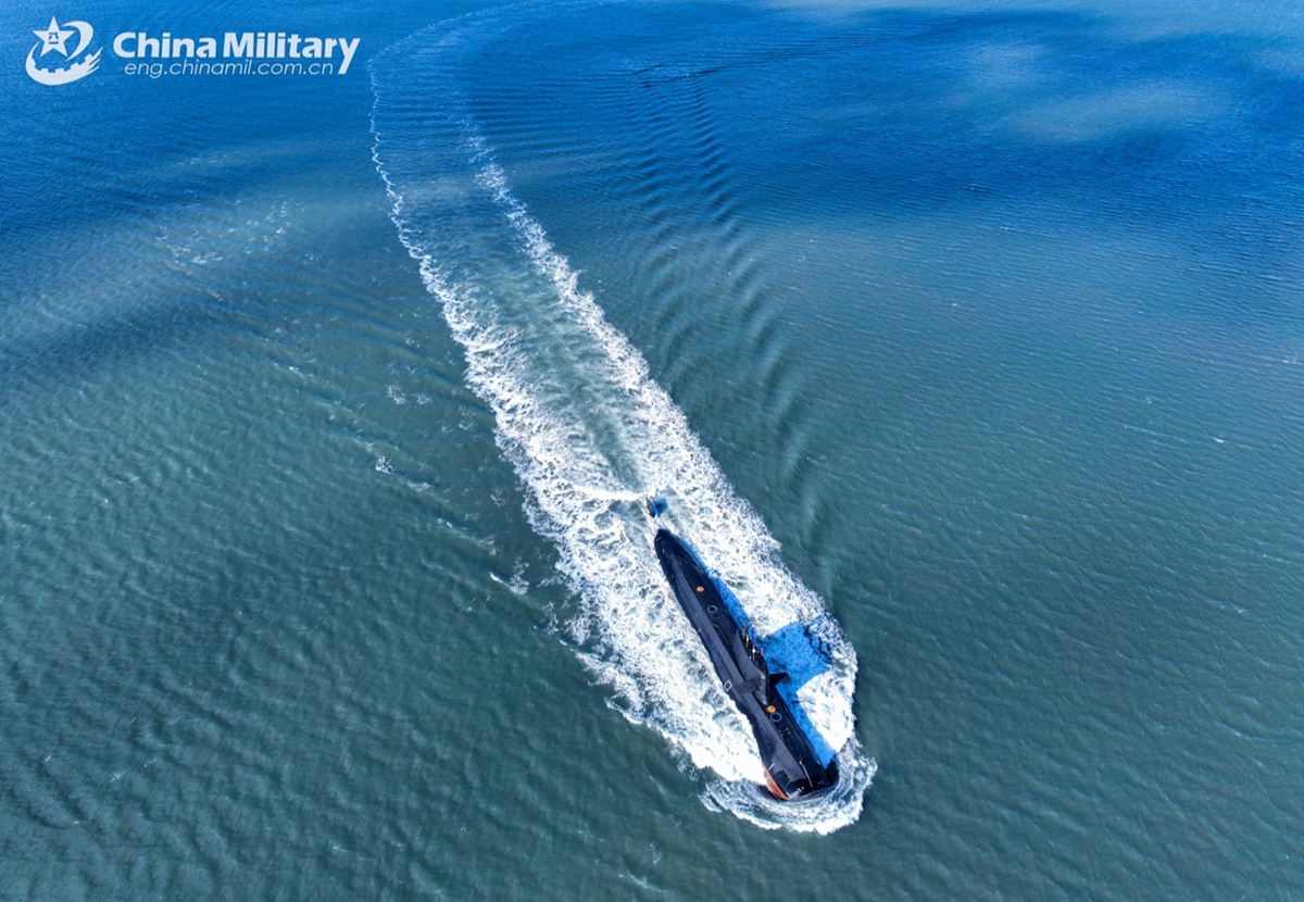 A submarine attached to a naval submarine flotilla under the Chinese PLA Northern Theater Command sails in a surface position during a combat training exercise on January 6, 2025. (eng.chinamil.com.cn/Photo by Zhang Nan)