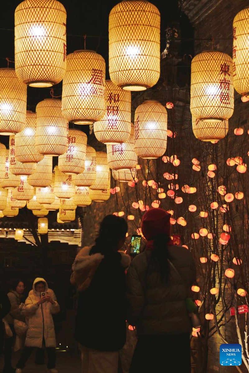 Tourists take photos of light installations in Datong, north China's Shanxi Province, Jan. 29, 2025. Various events were held across China on Wednesday to celebrate the Spring Festival. Photo: Xinhua