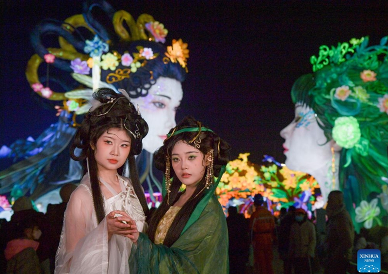 Tourists pose for photos at the 31st Zigong International Dinosaur Lantern Show in Zigong, southwest China's Sichuan Province, Jan. 17, 2025. The national-level intangible cultural heritage project Zigong lantern show boasts a long history, as it can be traced back to the Tang (618-907) and Song (960-1279) dynasties. In 1964, Zigong held the first lantern show celebrating the Spring Festival. So far, making colorful lanterns has become a popular industry here, with Zigong lanterns having been displayed in more than 80 countries and regions. Making a Zigong lantern involves many craftsmen, including art designers, bench workers, mechanics, electricians and paperhanging workers. The complete process can hardly be found in other places in China. Photo: Xinhua