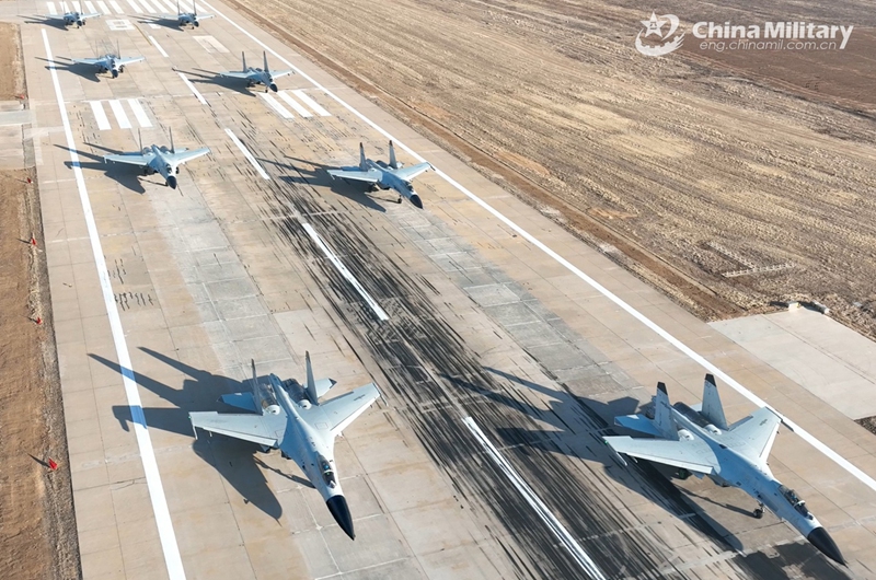 J-11BS fighter jets attached to the Chinese PLA Naval Aviation University taxi on the runway during a force-on-force flight training exercise on January 4, 2025. (eng.chinamil.com.cn/Photo by Zhang Zhiguang)