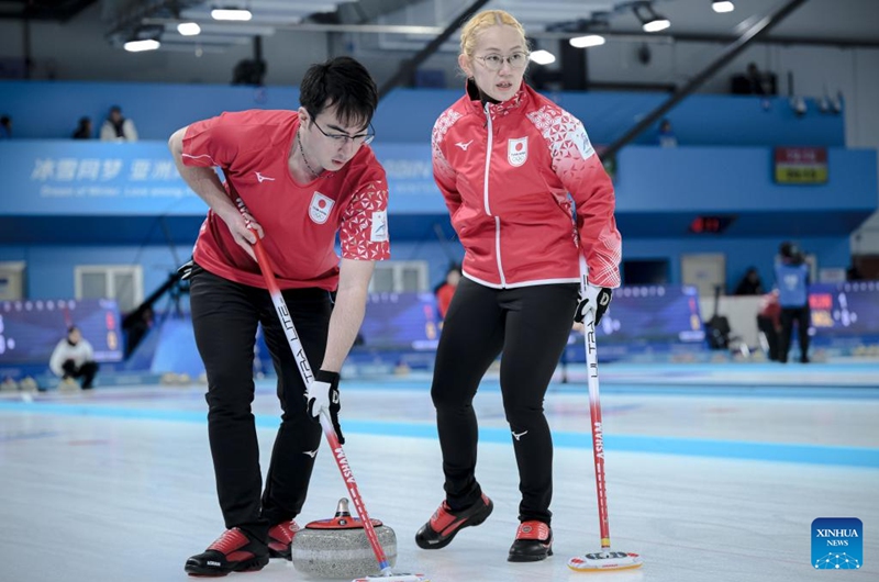 Koana Tori (R)/Aoki Go of Japan compete during the mixed doubles Round Robin Session 1 match against Chanatip Sonkham/Teekawin Jearateerawit of Thailand in the curling event at 2025 Asian Winter Games in Harbin, northeast China's Heilongjiang Province, Feb. 4, 2025. Photo: Xinhua