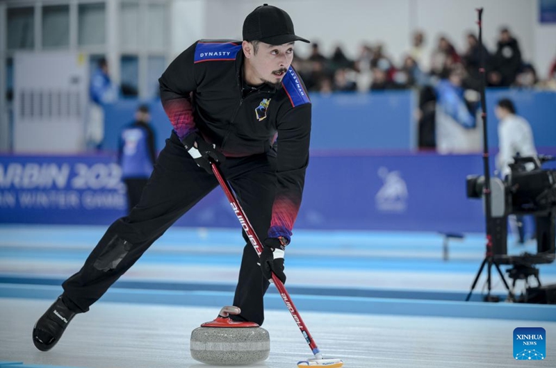 Marc Pfister of the Phillipines competes during the mixed doubles Round Robin Session 1 match between Kathleen Sumbillo Dubberstein/Marc Pfister of the Phillipines and Kim Kyeongae/Seong Jihoon of South Korea in the curling event at 2025 Asian Winter Games in Harbin, northeast China's Heilongjiang Province, Feb. 4, 2025. Photo: Xinhua